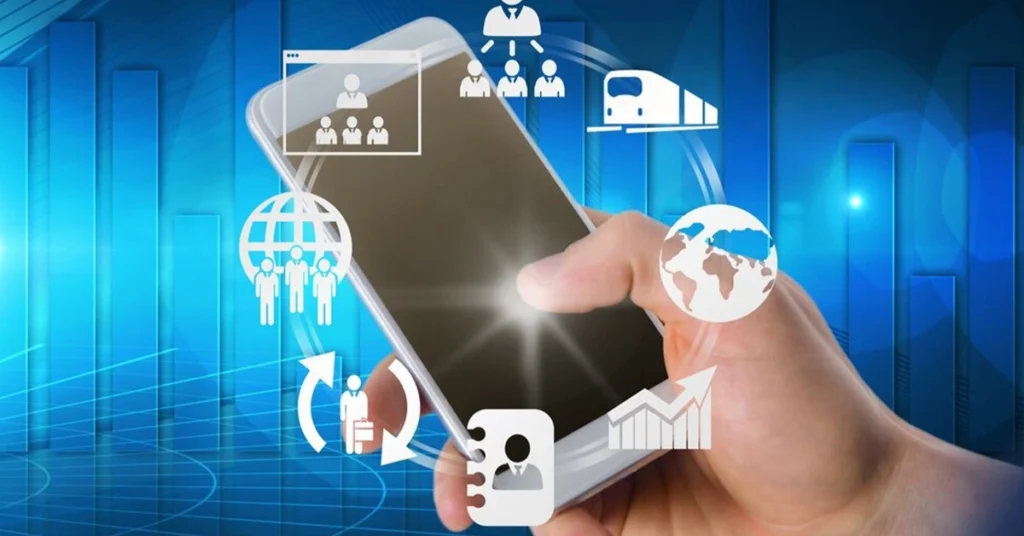 A hand holding a smartphone surrounded by glowing digital icons representing global business, team management, logistics, and data analytics against a blue bar chart background.
